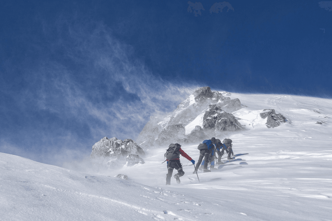 Snow-covered Khumbu peaks and glacial terrain under clear blue sky